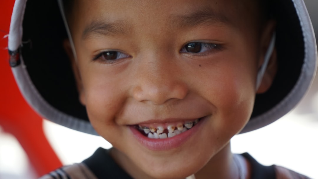 Happy siblings with healthy smiles ready for their dental visit