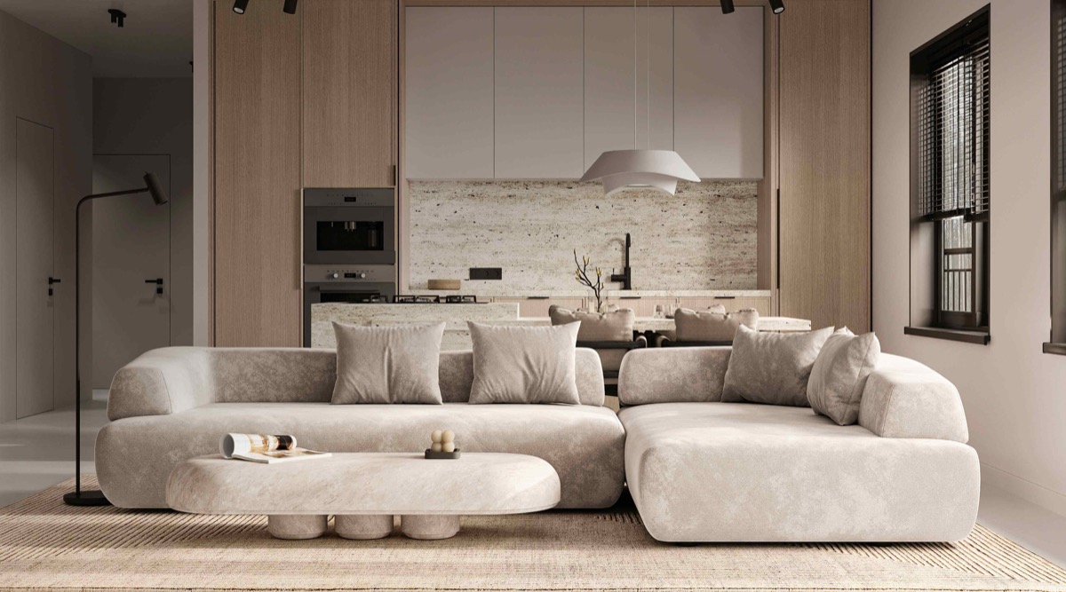 Modern living room with beige sofa and minimalist kitchen